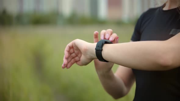 Runner Use Smart Watch. Runner Checking Pulse On Smartwatch On Running Workout. Fit Woman. alt