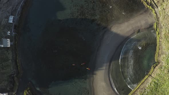 Aerial view of people doing kayak at Ilheu da Vila, Azores, Portugal. alt
