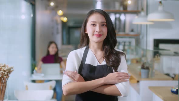 Beautiful business owner opening the doors and welcoming to her restaurant alt