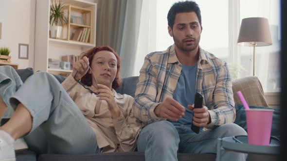 Couple Watching 3D Movie at Home alt