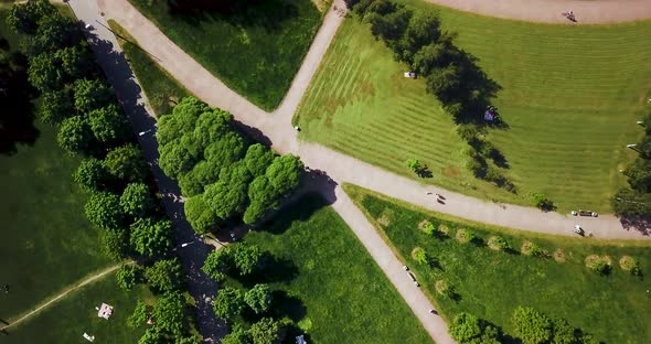 Flying Over the Green Recreation Park. Geometric Fields and Tracks. Summer Sunny Landscape. Aerial
