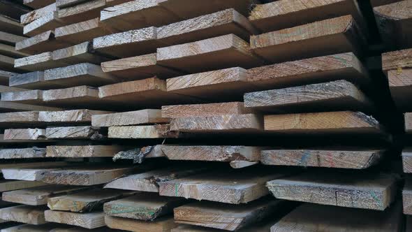Sawn Boards in a Stack. Lumber at a Sawmill or Building