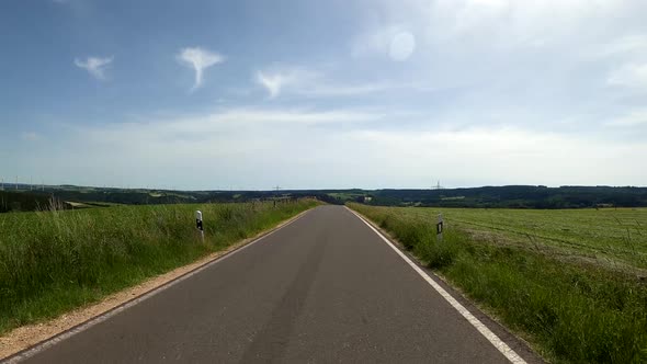POV Driving on motorcycle on a scenic road in Eifel National Park in Germany alt
