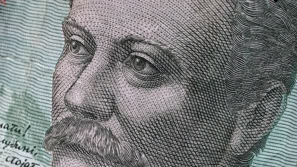 Ivan Franko on 20 UAH banknote rotating. Ukrainian currency, money. Top view, macro. alt