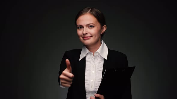 Attractive Brunette Business Woman with Giving Thumb Up