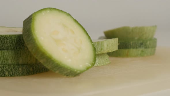 Tilting on Pepo cylindrica on cutting board close-up 4K 2160p 30fps UltraHD footage - Cuts of organi alt