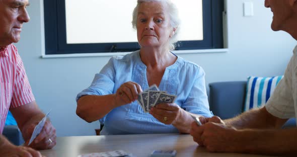 Seniors playing cards 4k alt