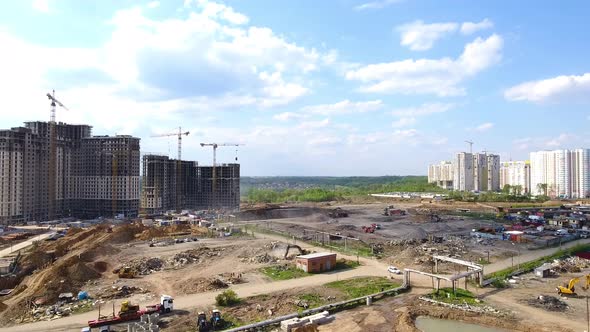 Drone Flies Over a Construction Site Near Moscow. Construction Cranes in The Industrial Zone.