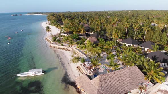 Paradise Coast Resort with Palm Trees and Hotels By Ocean Zanzibar Aerial View alt