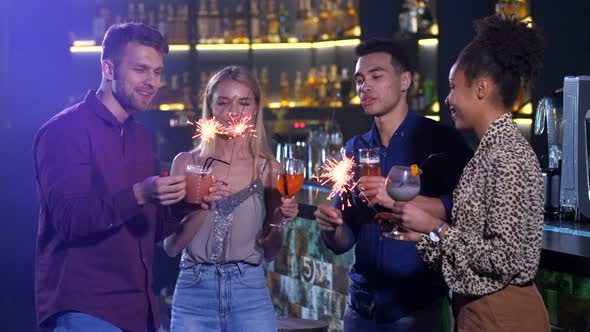 Good Friends Celebrating New Year's Holiday at Bar alt