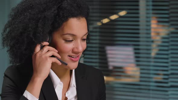 Portrait of African American Woman Wearing Headset Working to Support Remote Customer alt