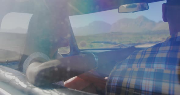 Young couple on a road trip in their pick-up truck alt
