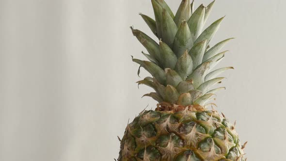 Fresh pineapple fruit close-up   4K 2160p 30fps UltraHD tilting   footage - Slow tilt Ananas comosus alt