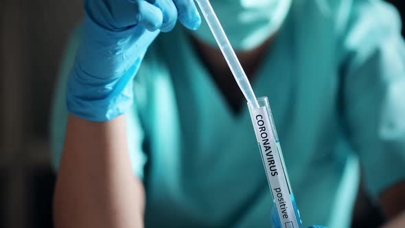 Doctor taking samples from coronavirus COVID-19 test tube