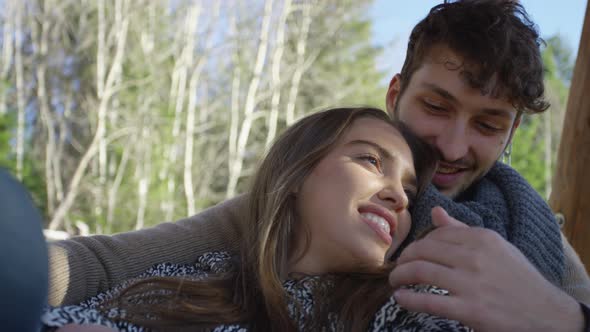 Man relaxing with his girlfriend alt