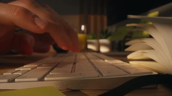 A Closeup Shot of a Man Typing Message on a Keyboard and Pressing Enter alt