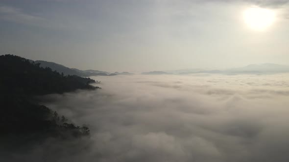 Aerial view and fly over sea of fog with sunrise cover mountain in area of Khao Kai Nui Thailand