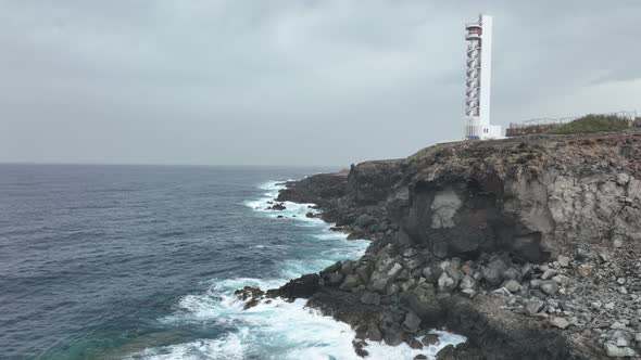 Lighthouse Look Out Tower Structure at Rocky Cliff Coast Atlantic Ocean Sea Line alt