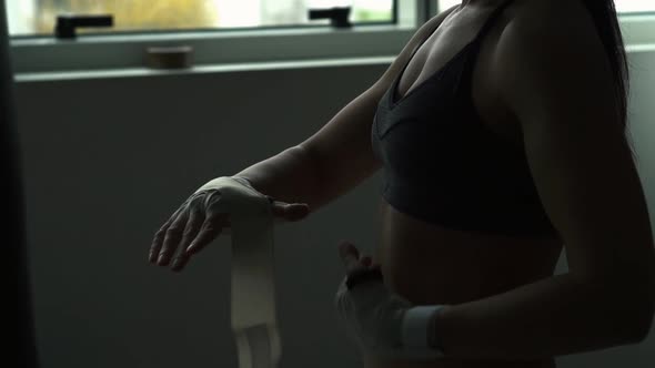 Woman getting ready for a boxing workout