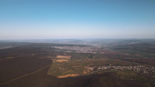 the Drone's Flight Over the City in the Morning at Sunrise alt