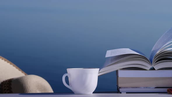 Coffee Cup and Books Outdoors