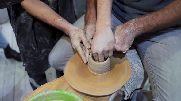 Making a Handmade Clay Pot in the Workshop. Pottery Lesson with Master. alt