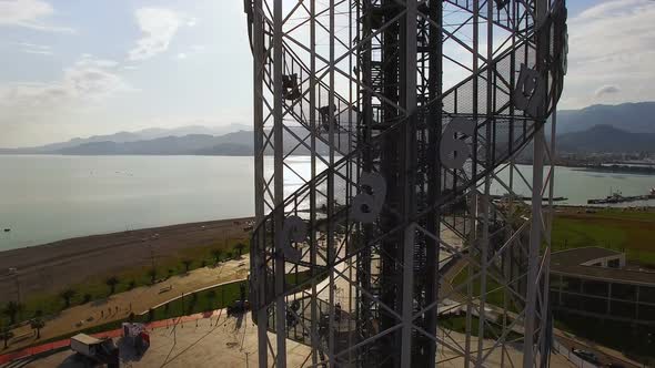 Alphabetic tower in Batumi Georgia against Black Sea and seafront area, culture alt