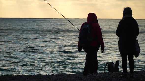 Man Hobby Fishing on Sea Tightens a Fishing Line Reel of Fish Summer alt
