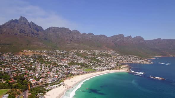 Aerial travel drone view of Camps Bay beach, Cape Town, South Africa. alt