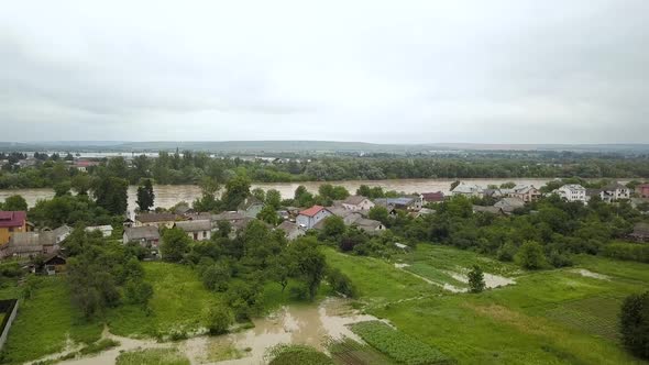 Aerial view of flooded houses with dirty water of Dnister river in Halych town, western Ukraine. alt