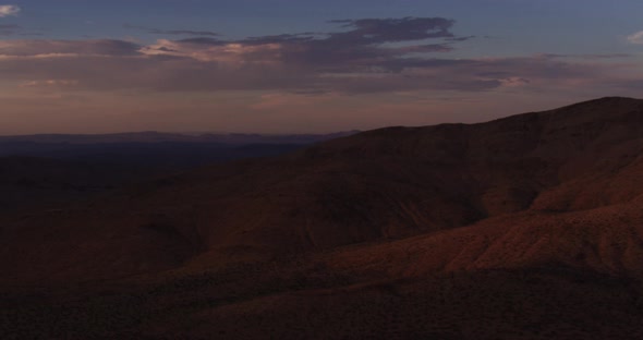 Helicopter aerial shot zooming into construction rigs and helipad in ocean, foggy day