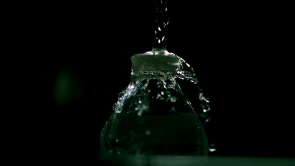 Water pouring from a faucet in ultra slow motion  alt