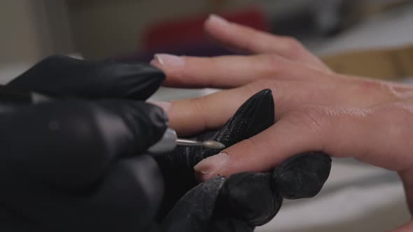 Master Nails in Black Gloves Holds Nail Manicure Tool. Set of Manicure Stirile Accessories in Box alt