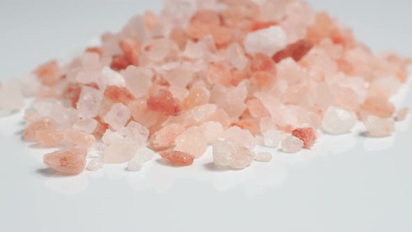 Rotation of raw Himalayan pink salt crystals.  alt