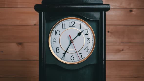 Timelapse of Vintage Clock with Movement of Time Hands on Wooden Background alt