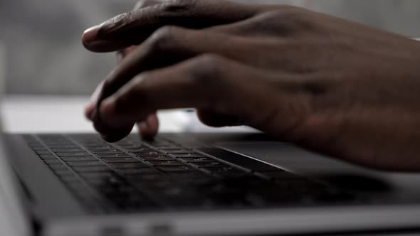 Close Up Hands African American Man Doctor Typing on Keyboard Laptop in Clinic alt