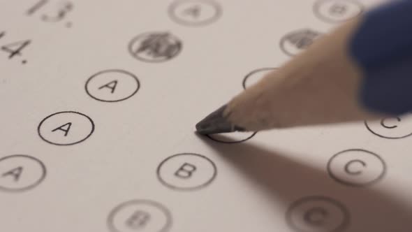 Changing Answer By Crossing It And Select Another One. Multiple Choice Examination. Close Up alt