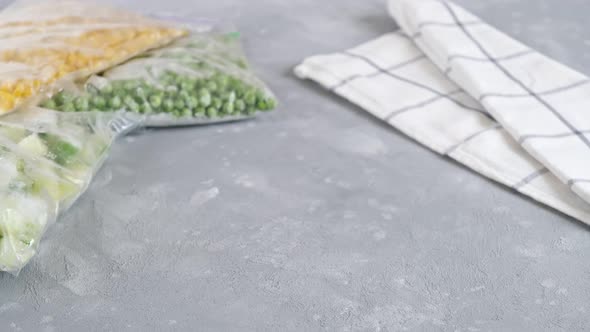 Frozen vegetables in a glass container. Mix of frozen vegetables. Frozen food.