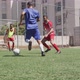 Soccer players having match on field