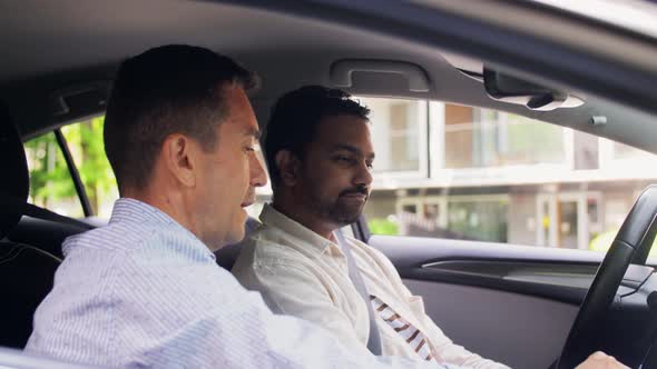 Car Driving School Instructor Teaching Male Driver alt