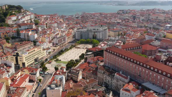 Aerial Orbit of Lisbon City Center with Traditional Colorful Houses Around Martim Moniz Square alt