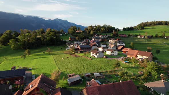 Aerial View of Liechtenstein with Houses on Green Fields in Alps Mountain Valley alt
