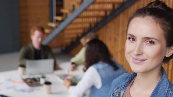Cheerful Young Businesswoman Smiling alt