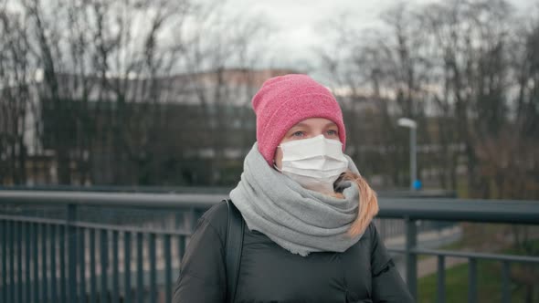 COVID-19 Coronavirus Pandemic: Woman in Mask and Gloves Is Sneezing and Coughing