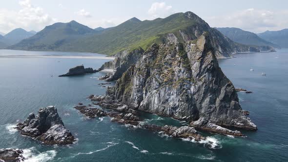 high mountains in the ocean and waves