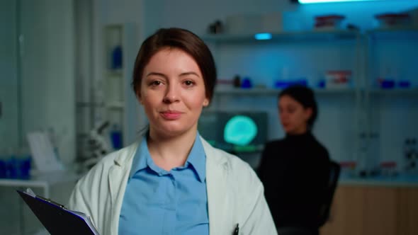 Close Up of Medical Neurologist Researcher Smiling at Camera Standing in Lab alt
