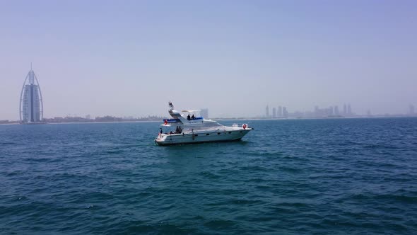 A yacht in the dubai summer. yacht burj al arab alt