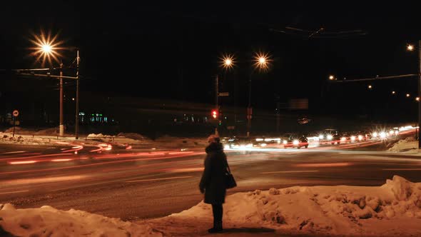 Crossroads in Winter with Pedestrians and Cars