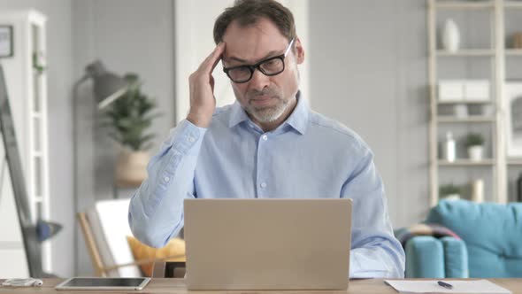 Senior Aged Businessman with Headache alt