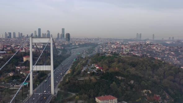 aerial video of Fatih Sultan Mehmet Bridge on a foggy day in Istanbul, Turkey alt